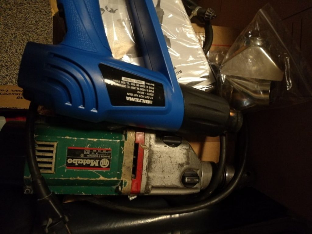 Power drill and a heat gun